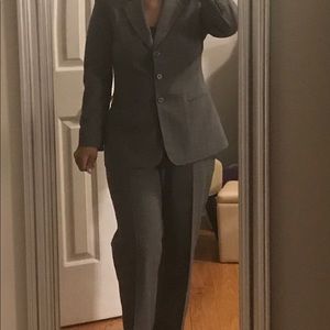 Be a Boss. Gray suit with pink pin stripes.